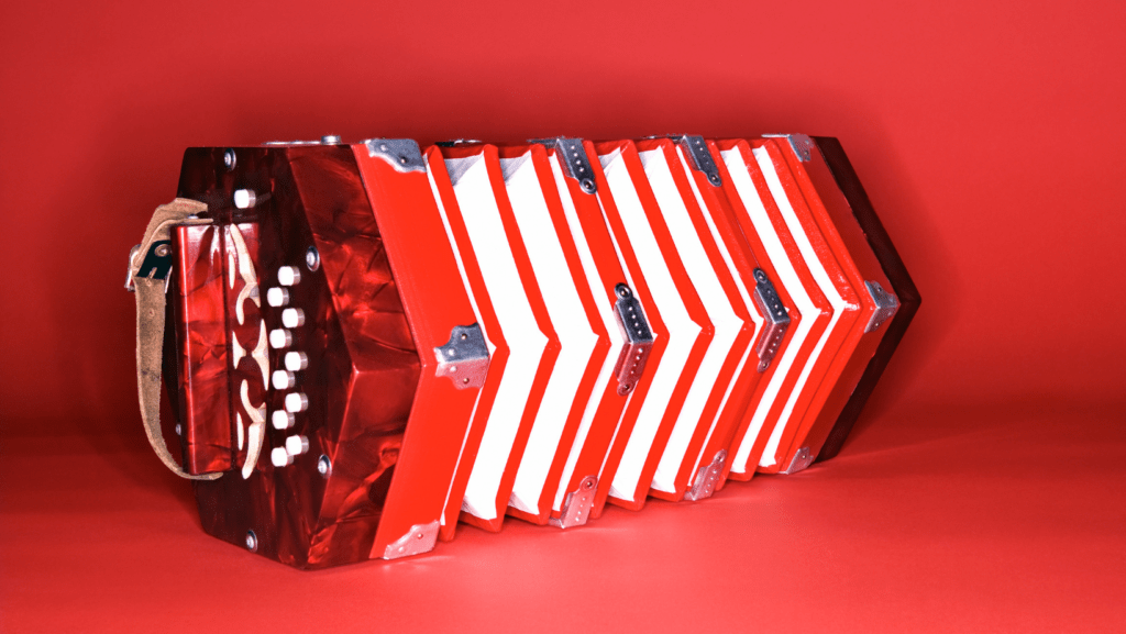 a nice red beginner concertina